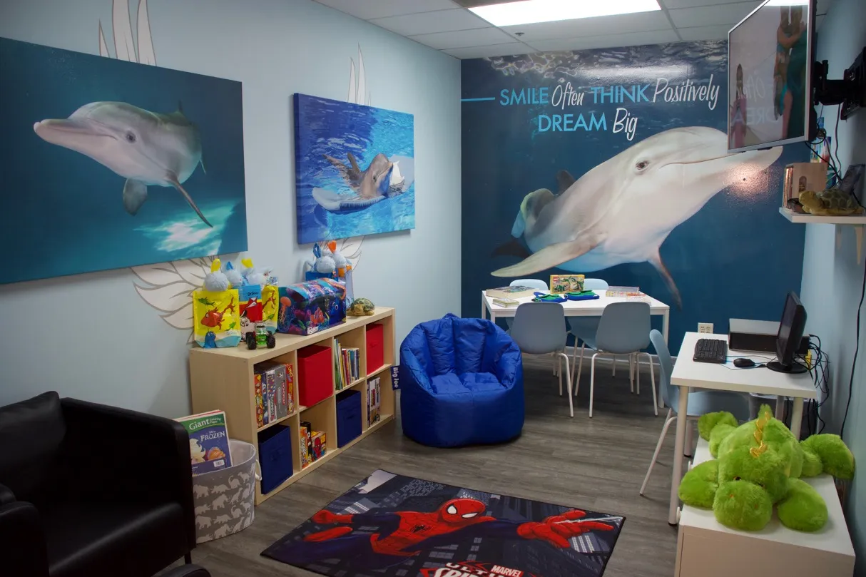 Angel Visitation Center room with dolphin murals and children's toys